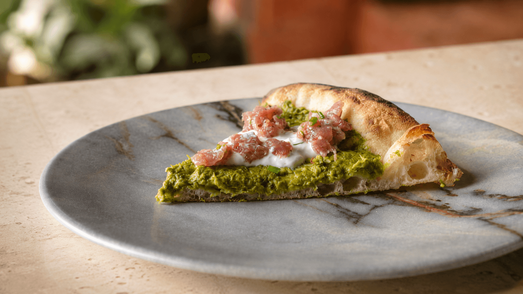 A contemporary Neapolitan pizza plated at Francesco Martucci in Wynwood